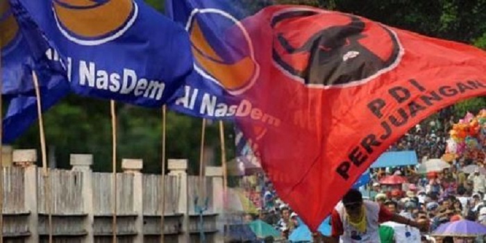 Bendera partai Nasdem bersisian dengan PDIP. (Foto: Fin.co.id)