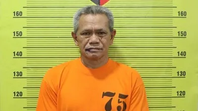 Bebas Ginting alias Bulang, tersangka pembakaran rumah hingga menewaskan wartawan di Kabupaten Karo Sumut, Rico Sempurna Pasaribu. (Foto: Polres Tanah Karo) 